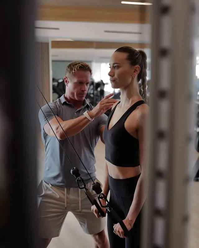 A personal training session on the studio floor at Bluprint Wellness